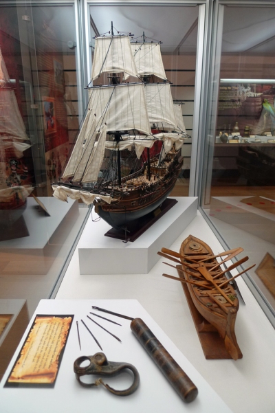 Model of the Black Pearl with sail makers needles and a model launch made by Warren Christian from Pitcain Island
