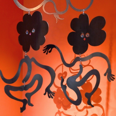 Image alt text 
Two black metal flower sculptures on an orange background

Photo Credit: Saelia Aparicio, A Joyful Parasite (2025) at Baltic Centre for Contemporary Art, Gateshead &copy; the artist. Photo: Reece Straw