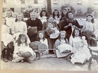 Shaldon Lace School about 1912, with Mrs French, Miss Lancaster Lucas and Mrs Ellen Withey (in centre L. to R.) Children in back row: Win Green, Kate Stead, Gwen Johnson Other children: Connie Extence, Flossey Parker, Ethel P., Cecil Finson, Marjorie Finson, Dorothy Hutchings, Dorah March.